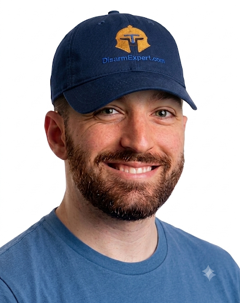 Smiling man wearing blue cap and shirt